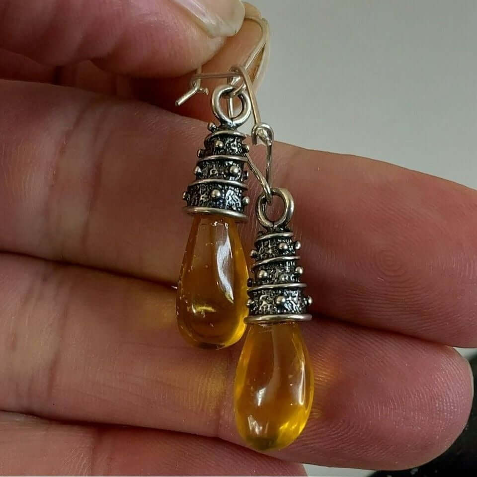 Sterling Silver 925 yellow amber dangle earrings with elegant wrapping accents, perfect for women’s birthstone jewelry and fashion.