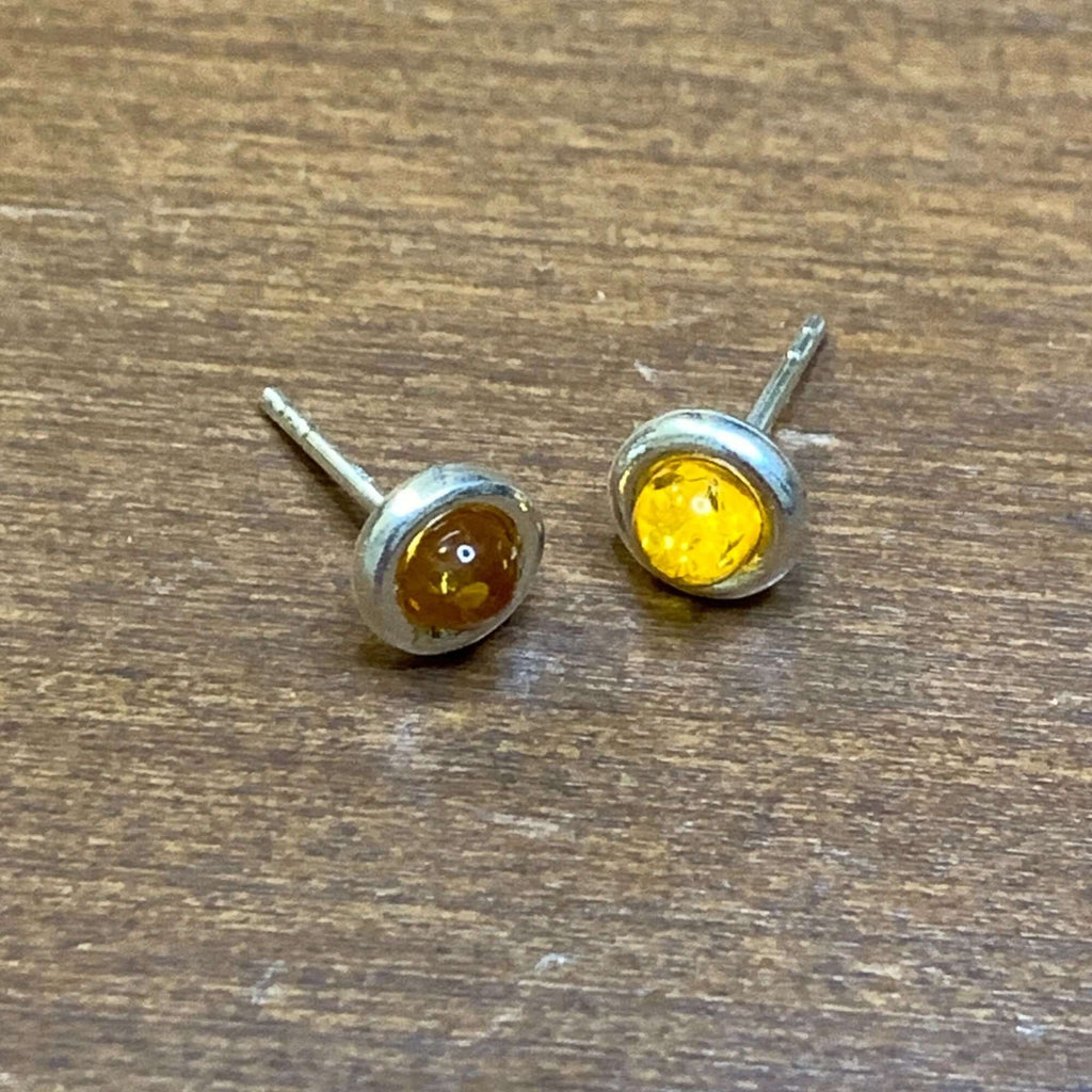 Sterling Silver 925 Women's Round Cognac Amber Stud Earrings featuring beautiful colors and surrounded by a silver setting.