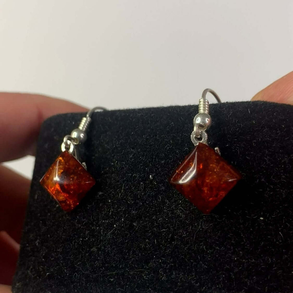 Sterling Silver 925 Diamond Shape Baltic Amber Drop Dangle Earrings with Beautiful Colors on Black Display