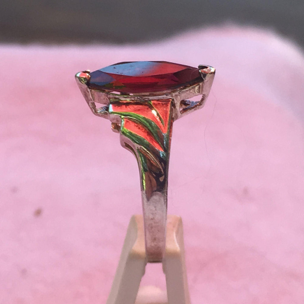 This would make a unique engagement ring and garnet is the birthstone for January