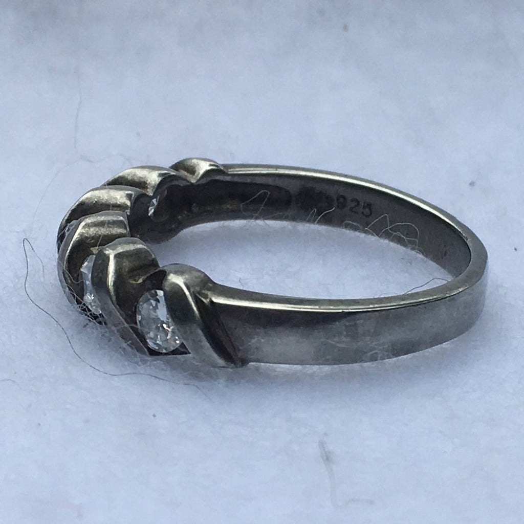 sterling silver with Hallmark 925 stamp in inner band